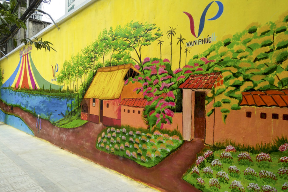 The Unique Mural Wall is a highlight not to be missed when visiting Van Phuc Silk Village